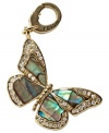 Flight of fancy. Fossil's butterfly charm, crafted from gold-tone mixed metal, features abalone and clear glass crystal details. Approximate length (charm): 1-1/4 inches; (clip): 1/2 inch.