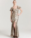 Cutout shoulders lend modernity to this floor-sweeping ABS by Allen Schwartz gown, encrusted with shimmering sequins.