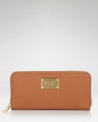 A chic zip-around wallet in luxe leather from MICHAEL Michael Kors. A chic zip-around wallet in luxe leather from MICHAEL Michael Kors.