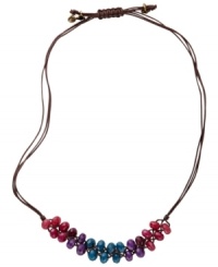 Grace your neck with colorful folksiness. The multicolored dyed jade beads on this Fossil necklace are placed on a chocolate-colored waxed cord with brass tone mixed metal floral charms. Adjustable sliding closure. Approximate length: 16 inches to 26 inches. Grace your neck with colorful folksiness. The multicolored dyed jade beads on this Fossil necklace are placed on a chocolate-colored waxed cord with brass tone mixed metal floral charms. Adjustable sliding closure. Approximate length: 16 inches to 26 inches.