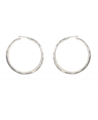 Traditional silver hoops with sparkling crystal accents. Kenneth Cole New York earrings liven any ensemble with a silver tone mixed metal setting and round-cut crystals. Approximate diameter: 1-3/4 inches. Traditional silver hoops with sparkling crystal accents. Kenneth Cole New York earrings liven any ensemble with a silver tone mixed metal setting and round-cut crystals. Approximate diameter: 1-3/4 inches.