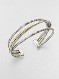 An iconic style with a crossover design featuring sleek sterling silver cables accented with radiant 18k gold. Sterling silver18k goldDiameter, about 2.5Slip-on styleImported 