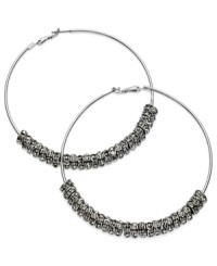 GUESS proves to be well-rounded with this pair of clutchless hoop earrings. Crafted from silver-tone mixed metal, the earrings feature silver-tone and glass crystal discs for a stunning effect. Approximate diameter: 2-1/2 inches. GUESS proves to be well-rounded with this pair of clutchless hoop earrings. Crafted from silver-tone mixed metal, the earrings feature silver-tone and glass crystal discs for a stunning effect. Approximate diameter: 2-1/2 inches.