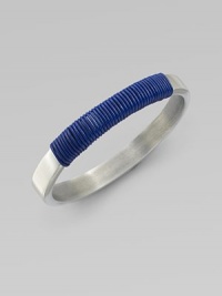 A modern, square-edged bangle of brushed aluminum, with a colorfully wrapped rich leather cord.LeatherAluminumDiameter, about 2¾Imported A modern, square-edged bangle of brushed aluminum, with a colorfully wrapped rich leather cord.LeatherAluminumDiameter, about 2¾Imported