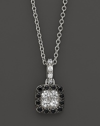 Black and white diamonds in a 14K. white gold setting. Black and white diamonds in a 14K. white gold setting.