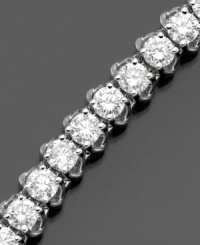 Elevate elegance with a seemingly endless display of diamonds. This beautiful diamond bracelet features round-cut diamonds (6 ct. t.w.) set in 14k white gold. 6 carat diamond bracelet approximate length: 7 inches. Elevate elegance with a seemingly endless display of diamonds. This beautiful diamond bracelet features round-cut diamonds (6 ct. t.w.) set in 14k white gold. 6 carat diamond bracelet approximate length: 7 inches.