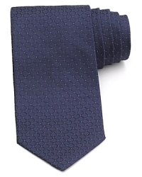 A diamond pane backdrop is peppered with dots for modern elegance. Feature this tie with a light-colored button down for a bold combination. A diamond pane backdrop is peppered with dots for modern elegance. Feature this tie with a light-colored button down for a bold combination.