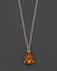 Detailed in 18K yellow gold, this Judith Ripka pear stone necklace frames a faceted honey corundum stone. Detailed in 18K yellow gold, this Judith Ripka pear stone necklace frames a faceted honey corundum stone.