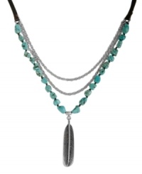 Light as a feather, heavy fashion. Lucky Brand's chic frontal necklace features a three-row design combining semi-precious reconstituted turquoise stones, silver tone mixed metal chains and a detailed feather charm. Draped on a nylon cord. Approximate length: 36 inches. Approximate drop: 3-3/4 inches.