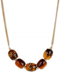 Add uniqueness to your look with this barrel-strung necklace from Kenneth Cole New York. Carved in tortoise resin, they're embellished with pave crystal accents. Crafted in gold tone mixed metal. Approximate length: 18 inches + 3-inch extender. Approximate drop: 3/4 inch. Add uniqueness to your look with this barrel-strung necklace from Kenneth Cole New York. Carved in tortoise resin, they're embellished with pave crystal accents. Crafted in gold tone mixed metal. Approximate length: 18 inches + 3-inch extender. Approximate drop: 3/4 inch.