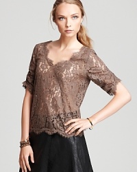 Embrace lace, fall's most sought-after trend, in this ethereal Joie top finished with a sweet scalloped hem. Embrace lace, fall's most sought-after trend, in this ethereal Joie top finished with a sweet scalloped hem.