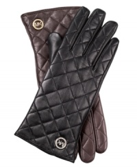 Join the quilted crowd with these luxe, leather gloves from MICHAEL Michael Kors. Chic signature-embossed detailing adds a touch of elegance, for a look that's altogether exquisite. Join the quilted crowd with these luxe, leather gloves from MICHAEL Michael Kors. Chic signature-embossed detailing adds a touch of elegance, for a look that's altogether exquisite.