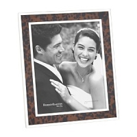 Accent your photographs with a nature-inspired frame from Reed & Barton, inlaid with faux tortoise and banded with tarnish-resistant silver-plate for an attractive display at home or the office. Accent your photographs with a nature-inspired frame from Reed & Barton, inlaid with faux tortoise and banded with tarnish-resistant silver-plate for an attractive display at home or the office.