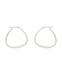 Traditional hoops with an up-to-date twist. Kenneth Cole New York earrings feature a modern pear-shaped hoop in silver tone mixed metal. Approximate diameter: 1 inch. Traditional hoops with an up-to-date twist. Kenneth Cole New York earrings feature a modern pear-shaped hoop in silver tone mixed metal. Approximate diameter: 1 inch.