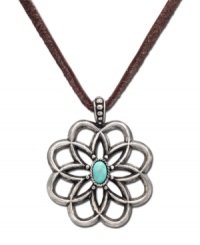 Worn long or wrapped up short, this Lucky Brand necklace adds the perfect amount of rugged charm to any look. Flower pendant carved in worn silver tone mixed metal with semi-precious reconstituted calcite turquoise stone at center of petals. Suspended from brown cord. Approximate length: 34 inches. Approximate drop: 2 inches.