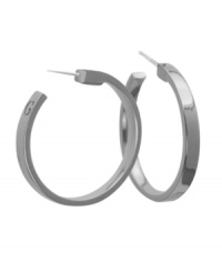 Add instant style in must-have hoops. GUESS earrings feature a 3/4 hoop with a G engraved at the back. Crafted in silver tone mixed metal. Approximate diameter: 1-1/2 inches. Add instant style in must-have hoops. GUESS earrings feature a 3/4 hoop with a G engraved at the back. Crafted in silver tone mixed metal. Approximate diameter: 1-1/2 inches.