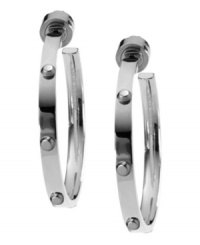 Bring some edge to a timeless look. Michael Kors added stud detail to a classic metal hoop earring. Crafted in silver tone mixed metal. Approximate diameter: 1 inches. Bring some edge to a timeless look. Michael Kors added stud detail to a classic metal hoop earring. Crafted in silver tone mixed metal. Approximate diameter: 1 inches.
