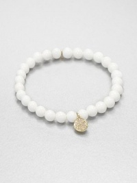 From the Discs Collection. A glossy sea clam beaded bracelet accented with a diamond accented 14k gold charm. Sea clam shells14k goldDiamonds, .12 tcwLength, about 6.5Slip-on styleImported From the Discs Collection. A glossy sea clam beaded bracelet accented with a diamond accented 14k gold charm. Sea clam shells14k goldDiamonds, .12 tcwLength, about 6.5Slip-on styleImported