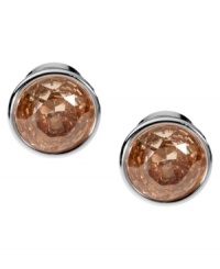 Smoky hues captivate the senses. Michael Kors' elegant stud earrings boast round-cut smoky topaz-colored cubic zirconia set in silver tone mixed metal. Approximate diameter: 1/2 inch. Smoky hues captivate the senses. Michael Kors' elegant stud earrings boast round-cut smoky topaz-colored cubic zirconia set in silver tone mixed metal. Approximate diameter: 1/2 inch.