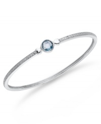 Bangle love. You'll adore Victoria Townsend's stunning sterling silver bangle with its pretty round-cut blue topaz (1-1/2 ct. t.w.) and sparkling diamond accents. Approximate circumference: 8 inches. Bangle love. You'll adore Victoria Townsend's stunning sterling silver bangle with its pretty round-cut blue topaz (1-1/2 ct. t.w.) and sparkling diamond accents. Approximate circumference: 8 inches.