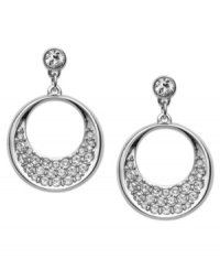 A modern interpretation of the circle motif. Swarovski's pair of rhodium-plated pierced earrings exude sophistication. Dangling circles are embellished in glittering clear crystal pavé. Set in rhodium-plated mixed metal. Approximate drop: 1 inch. A modern interpretation of the circle motif. Swarovski's pair of rhodium-plated pierced earrings exude sophistication. Dangling circles are embellished in glittering clear crystal pavé. Set in rhodium-plated mixed metal. Approximate drop: 1 inch.