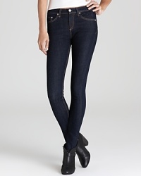Dark wash, high rise rag & bone/JEAN skinny jeans retain timeless style while flaunting trend-forward details for a directional look to rock all year. Dark wash, high rise rag & bone/JEAN skinny jeans retain timeless style while flaunting trend-forward details for a directional look to rock all year.