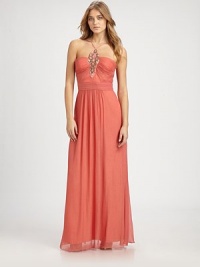 Airy chiffon in a floor length silhouette, accented with a prettily beaded front.Halter style neckline with spaghetti strapsBeaded front detailRuched bodiceBanded waistConcealed back zipFully linedAbout 45 from natural waistPolyesterSpot cleanImportedModel shown is 5'10 (177cm) wearing US size 4. Airy chiffon in a floor length silhouette, accented with a prettily beaded front.Halter style neckline with spaghetti strapsBeaded front detailRuched bodiceBanded waistConcealed back zipFully linedAbout 45 from natural waistPolyesterSpot cleanImportedModel shown is 5'10 (177cm) wearing US size 4.