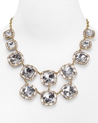 Paint the town gold with this kate spade new york statement necklace, accented by a bib of bold crystal stone stations. It's a luxe layering piece. Paint the town gold with this kate spade new york statement necklace, accented by a bib of bold crystal stone stations. It's a luxe layering piece.