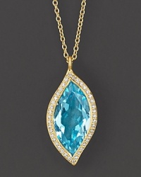 Pavé diamonds circle a sky blue topaz leaf, set in 18K yellow gold. Pavé diamonds circle a sky blue topaz leaf, set in 18K yellow gold.