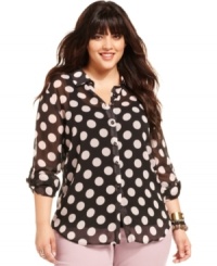 See spots in American Rag's super-cute plus size top, featuring a bold polka dot print.