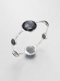 From the Wonderland Collection. Round faceted hematite doublet stations in various sizes set on a hammered sterling silver bangle. Hematite doubletSterling silverDiameter, about 2.5Slip-on styleImported From the Wonderland Collection. Round faceted hematite doublet stations in various sizes set on a hammered sterling silver bangle. Hematite doubletSterling silverDiameter, about 2.5Slip-on styleImported