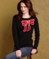 Basic gets statement-making with Tommy Hilfiger's sweater, featuring a chic intarsia bow design.