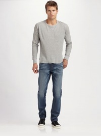 A slim and slouchy fit in medium-wash denim, finished with rips, whiskers, and the look of a well-worn favorite. Five-pocket style Tapered fit with slouchy legs Logo patch on back waist Inseam, about 33 Cotton Machine wash Made in USA A slim and slouchy fit in medium-wash denim, finished with rips, whiskers, and the look of a well-worn favorite. Five-pocket style Tapered fit with slouchy legs Logo patch on back waist Inseam, about 33 Cotton Machine wash Made in USA