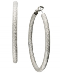 A style must-have, every girl needs at least one pair of hoops in her accessory collection. INC International Concepts' style features a diamond dust design set in silver tone mixed metal. Approximate diameter: 2 inches.