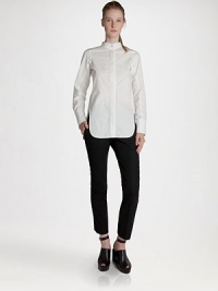 A sculptural stand collar defines this crisply tailored poplin design.Stand collar with button closureConcealed button frontLong sleeves with button cuffsVented hemlineCotton/polyamide/elastaneDry cleanMade in ItalyModel shown is 5'10 (177cm) wearing US size 4. A sculptural stand collar defines this crisply tailored poplin design.Stand collar with button closureConcealed button frontLong sleeves with button cuffsVented hemlineCotton/polyamide/elastaneDry cleanMade in ItalyModel shown is 5'10 (177cm) wearing US size 4.