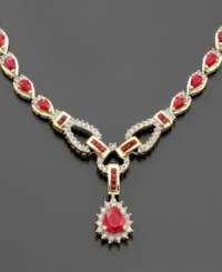 Blazing with the grand splendor of a stunning 12 ct. t.w. of rubies and 1 1/6 ct. t.w. of diamonds, this striking 14K gold toggle-style necklace will make any event a gala occasion. Prized for centuries as a symbol for royalty, the regal ruby is the birthstone for July. Blazing with the grand splendor of a stunning 12 ct. t.w. of rubies and 1 1/6 ct. t.w. of diamonds, this striking 14K gold toggle-style necklace will make any event a gala occasion. Prized for centuries as a symbol for royalty, the regal ruby is the birthstone for July.