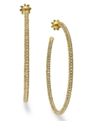 Hoop dreams. Juicy Couture offers these gold tone earrings, crafted from brass, and adorned with glass accents for a touch of glamour. Approximate diameter: 2-1/2 inches. Hoop dreams. Juicy Couture offers these gold tone earrings, crafted from brass, and adorned with glass accents for a touch of glamour. Approximate diameter: 2-1/2 inches.