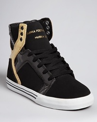 Supra's cutting-edge sneaker style is rendered in a cool combination of soft nubuk and reflective patent leather. Supra's cutting-edge sneaker style is rendered in a cool combination of soft nubuk and reflective patent leather.