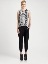 Injected with an edgy minimalist attitude, this silk-like top completes the look with an abstract pheasant print, contour hem and pleated back yoke. RoundneckSleevelessPleated back yokeContour hemLonger length hits below the hipsViscoseDry cleanImported of Italian fabricModel shown is 5'11 (178cm) wearing US size Small. Injected with an edgy minimalist attitude, this silk-like top completes the look with an abstract pheasant print, contour hem and pleated back yoke. RoundneckSleevelessPleated back yokeContour hemLonger length hits below the hipsViscoseDry cleanImported of Italian fabricModel shown is 5'11 (178cm) wearing US size Small.