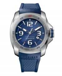 Cool blue but tough as nails. Sport watch by Tommy Hilfiger crafted from navy blue silicone strap and round stainless steel case. Blue numerals and red flag logo at bezel. Brushed blue dial features silver tone stick indices, white numerals at twelve, three, six and nine o'clock, date window at four o'clock, luminous hour and minute hands, red-tipped second hand and text logo. Quartz movement. Water resistant to 50 meters. Ten-year limited warranty. Cool blue but tough as nails. Sport watch by Tommy Hilfiger crafted from navy blue silicone strap and round stainless steel case. Blue numerals and red flag logo at bezel. Brushed blue dial features silver tone stick indices, white numerals at twelve, three, six and nine o'clock, date window at four o'clock, luminous hour and minute hands, red-tipped second hand and text logo. Quartz movement. Water resistant to 50 meters. Ten-year limited warranty.