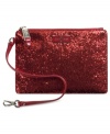 Get your glam on with this luxe little lovely from Cole Haan. Adorned with glorious glitter, signature detailing and convenient wristlet strap, it's your perfect party partner.