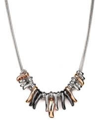 Raise the bar. Nine West's trendy necklace combines graduated bars of silver, rose gold and hematite tone mixed metal on a doubled snake chain. Approximate length: 16 inches + 2-inch extender. Approximate drop length: 3/4 inch. Approximate drop width: 2-3/4 inches. Raise the bar. Nine West's trendy necklace combines graduated bars of silver, rose gold and hematite tone mixed metal on a doubled snake chain. Approximate length: 16 inches + 2-inch extender. Approximate drop length: 3/4 inch. Approximate drop width: 2-3/4 inches.