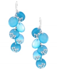 Wash your blues away with a bright pop of color. Kenneth Cole New York's stunning shaky earrings feature turquoise-colored resin circles accented by crystals. Set in silver tone mixed metal. Approximate drop: 2-4/10 inches. Wash your blues away with a bright pop of color. Kenneth Cole New York's stunning shaky earrings feature turquoise-colored resin circles accented by crystals. Set in silver tone mixed metal. Approximate drop: 2-4/10 inches.