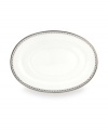 Designed to mimic a strand of lustrous pearls. With imitation pearl accents and platinum rims on fine bone china.
