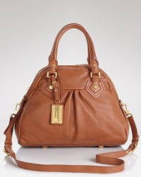 Introduce a dose of city-pretty into your purse portfolio with this satchel from MARC BY MARC JACOBS. Crafted of pebbled leather, it's sure to look as urban (or urbane) with denim as with dresses. Introduce a dose of city-pretty into your purse portfolio with this satchel from MARC BY MARC JACOBS. Crafted of pebbled leather, it's sure to look as urban (or urbane) with denim as with dresses.