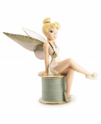 Disney's Tinkerbell sits primly atop a spool of thread in this vividly detailed porcelain figurine by Lenox. Accented with 24-karat gold. Disney's Tinkerbell sits primly atop a spool of thread in this vividly detailed porcelain figurine by Lenox. Accented with 24-karat gold.
