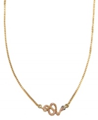 Biting style, from RACHEL Rachel Roy. This slinking necklace features a coiled snake decorated by glass stones and purple epoxy. Set in worn gold tone mixed metal. Approximate length: 16 inches + 2-inch extender. Biting style, from RACHEL Rachel Roy. This slinking necklace features a coiled snake decorated by glass stones and purple epoxy. Set in worn gold tone mixed metal. Approximate length: 16 inches + 2-inch extender.