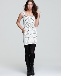 Rendered in super-stretchy lace, this curve-defining Free People dress flaunts a black underpinning for a striking contrast. Rendered in super-stretchy lace, this curve-defining Free People dress flaunts a black underpinning for a striking contrast.