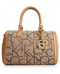 Wear to work or on a weekend getaway, this charming silhouette from Calvin Klein features signature jacquard, soft leather trim and high-shine hardware that lends a look of modern elegance. And the well-organized interior ensures all your essentials are stored with care. Wear to work or on a weekend getaway, this charming silhouette from Calvin Klein features signature jacquard, soft leather trim and high-shine hardware that lends a look of modern elegance. And the well-organized interior ensures all your essentials are stored with care.