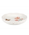 The whimsical butterflies and blooms of Butterfly Meadow dinnerware grace this shallow serving bowl, an irresistible way to serve everything from pasta and veggies, to cinnamon buns. With scalloped detail in white porcelain. From Lenox's collection of serveware and serving dishes.